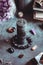 Black candle on a witch`s altar for a magical ritual