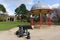 Black Cannon in Front of a Wrought Iron Bandstand.