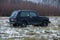 Black car Niva in winter. Made in USSR, 4 x4 jeep. Travel urban photo 2018