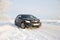Black car on winter snowy road . Winter road. Journey. Russia, Gatchina 22 January 2019