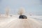 Black car on winter snowy road . Winter road. Journey. Russia, Gatchina 22 January 2019