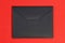 Black cardboard envelope isolated with clipping path