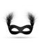 Black carnival mask with fluffy feathers isolated on white