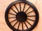 Black cart wheel onthe wooden - image