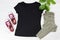 Black casual T shirt mock up top view - casual clothes background, red sneakers