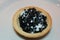 Black caviar with cream on a tartlet. To the festive table.