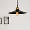 Black ceiling lamp with decorative light bulb