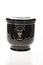 Black cemetery urn with golden calyx