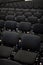 Black chairs in big empty congress room