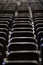 Black chairs in big empty congress room