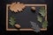 Black chalk board with leaves lying on it, Generative AI