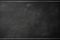 Black chalkboard background with horizontal lines at top and bottom and gray smudges