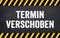 Black chalkboard with the german words for This event is postponed - Termin Event verschoben