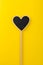 Black chalkboard heart on a wooden stick