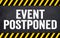 Black chalkboard with message This event is postponed