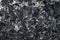 Black charred coals closeup, background of coals
