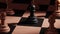 Black chess pawn surrounded by white pawns 3D animation