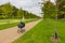 Black children`s carriage on the avenue in the Palace Garden, Fredensborg, Denmark.