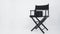 Black Clapper board or movie slate with director chair use in video production or movie and cinema industry. It`s put on white