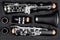 Black clarinet  silver wooden woodwind musical brass instrument in pieces parts music case. classic orchestra symphony background