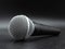 Black classic microphone on dark background, microphone concept