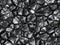 Black coal texture taken closeup as background.Digitally generated image.