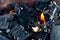 Black coals and orange flame - a fire
