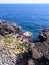 Black coastline with lava cliffs in Catania