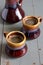 Black coffee in brown and gray ceramic cups