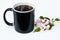 Black coffee cup with cherry blossoms