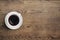 Black coffee cup on old wooden table top view