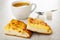 Black coffee in cup  spoon  sugar  pieces of flatbread with cheese on wooden table