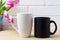 Black coffee cup and white cappuccino mug mockup with magenta tu