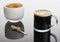 Black coffee and froth in glass mug with sugar