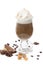 Black coffee with whipped cream in frappe glasses on a white background with cinnamon sticks, spices, coffee beans and