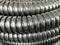Black coiled corrugated insulation tube at warehouse