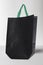 Black Color Eco friendly Reusable Bag with Green Handle on White background