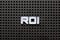 Black color pegboard with white letter in word ROI Abbreviation of Return on Investment