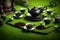 Black color tea pot with cups in natural greenery