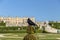 Black common raven with Versailles castle on the background