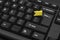 Black computer keyboard and yellow check mark. Important key Enter