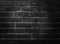 Black concrete wall, brick pattern background, stage backdrop with spotlight