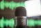 Black condenser microphone, mic blur green waveform background