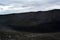 Black cone-shaped crater of the extinct volcano Nverfjall in Iceland