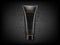 Black cosmetic plastic tube with charcoal powder explosion on black background. Charcoal detox cream or face mask, cosmetic