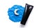 Black cosmetic tube and blue night plasticine sky with white month or moon on white background. Skincare cosmetology product,