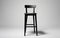 Black counter stool against a white background -Generative Ai