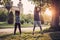 Black couple doing exercise outdoors