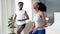 Black couple, energy workout and house bedroom for lockdown exercise, training or wellness fitness. Smile, happy and