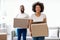 Black Couple Moving Carrying Packed Cardboard Boxes Into New Home